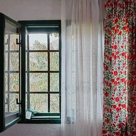 House In The Middle Of A Quiet Bosnian Village